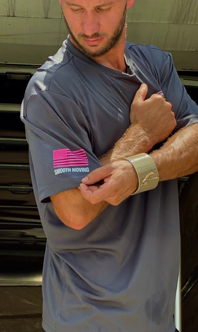 Smooth Moving crew member in a branded shirt