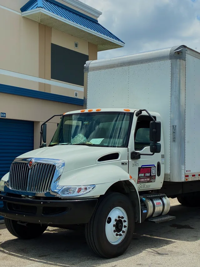 Smooth Moving box truck parked at a storage facility